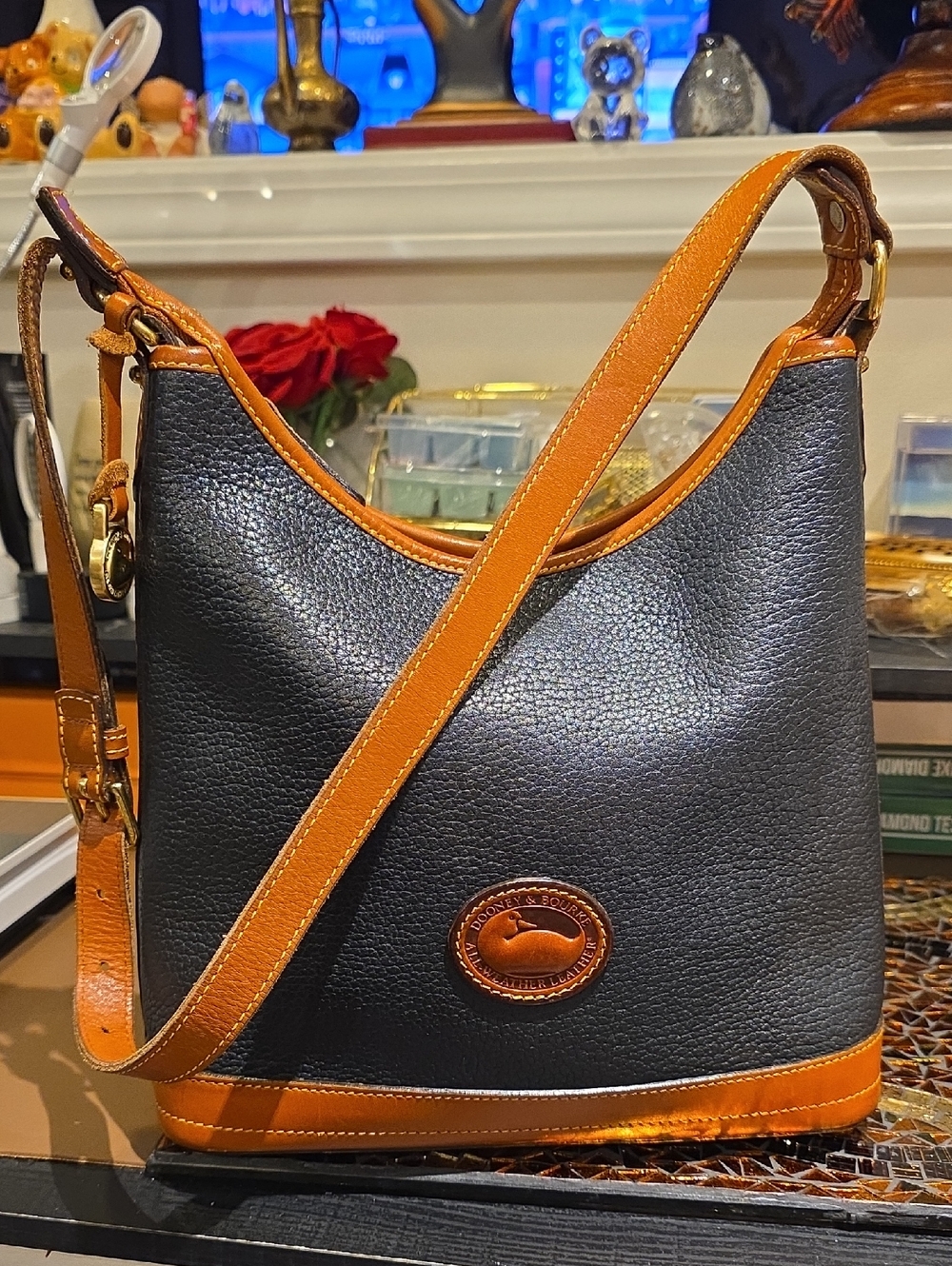 Dooney & Bourke Black with Brown Trim Pebbled Leather Shoulder Bag